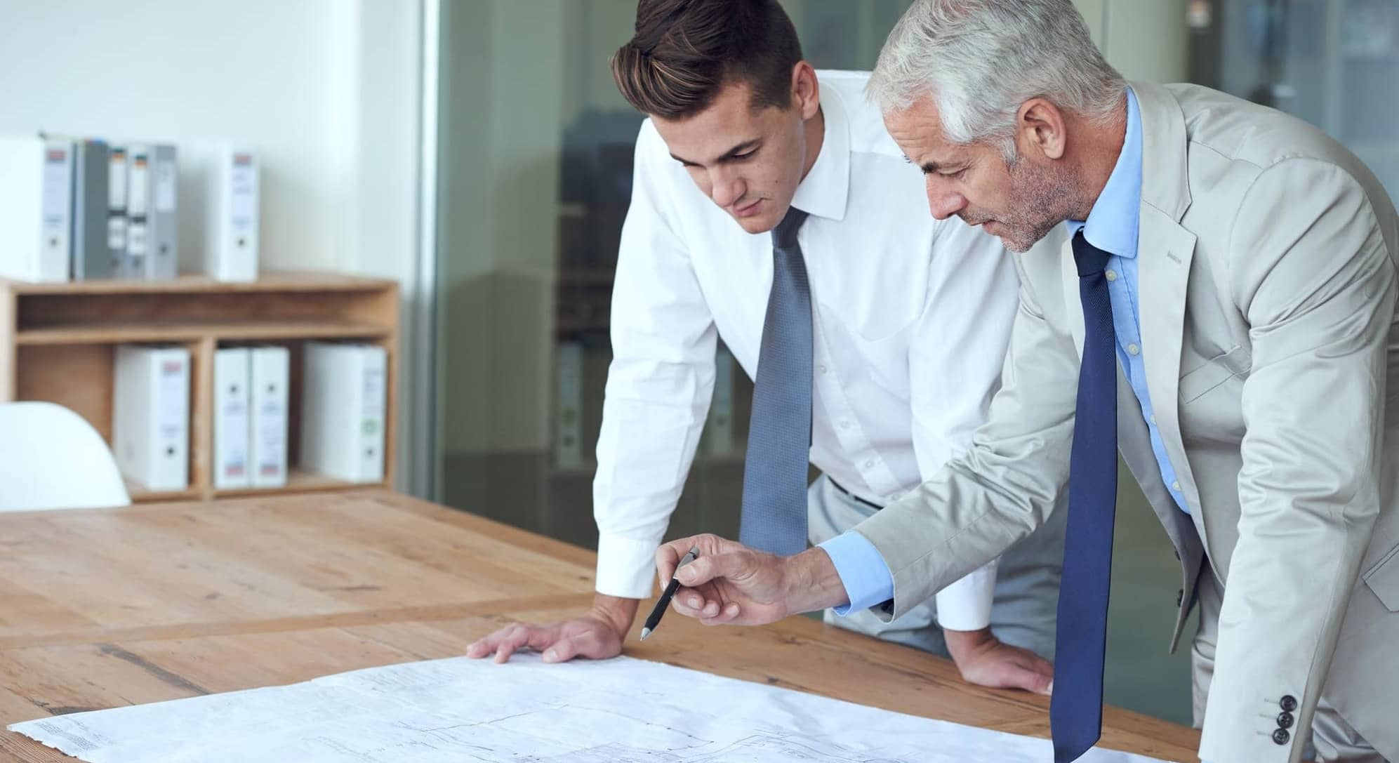 First-time home buyers reviewing their new home plans